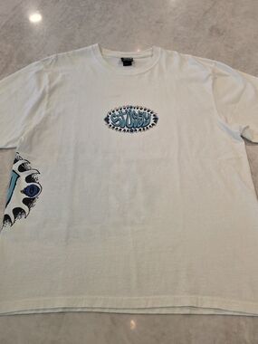 Stüssy White Graphic Crewneck T-Shirt with Blue Logo